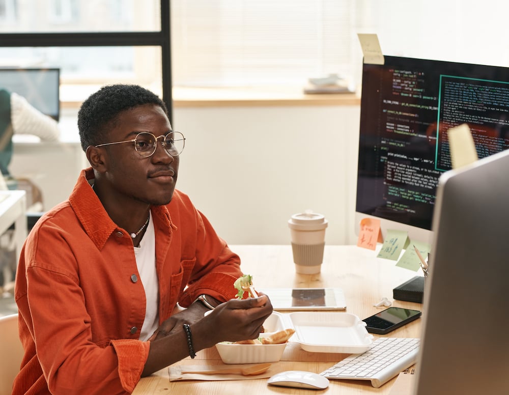 young-african-american-it-engineer-looking-at-comp-2022-11-01-22-19-17-utc young-african-american-it-engineer-looking-at-comp-2022-11-01-22-19-17-utc